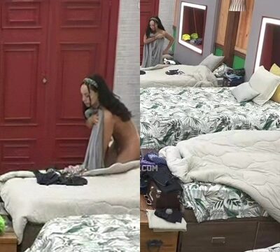 Hermosa mujer en toalla siendo filmada en cámara
