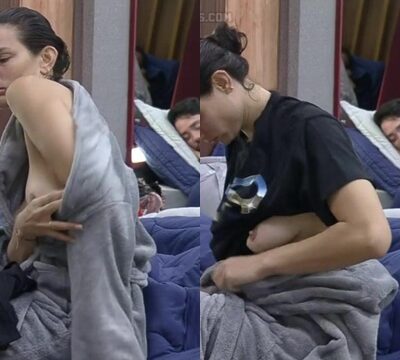 Mujer mostrando sus pechos mientras se cambia de ropa y se sensualiza