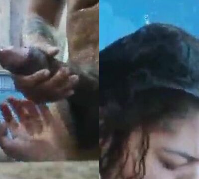 Mujer chupando la polla de un hombre en la piscina