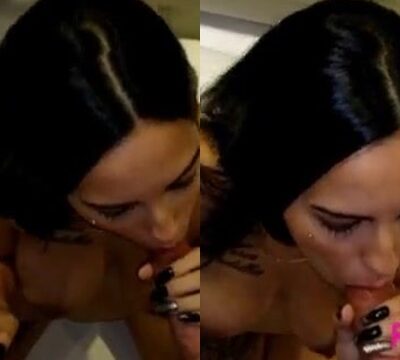 Mujer fumando cigarrillo y chupando polla