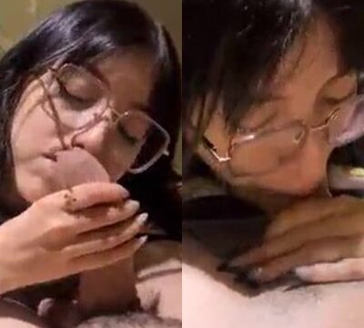 Hermosa mujer con gafas chupando una polla gruesa y deliciosa