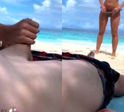 Hombre comiéndole el coño a su mujer en la playa