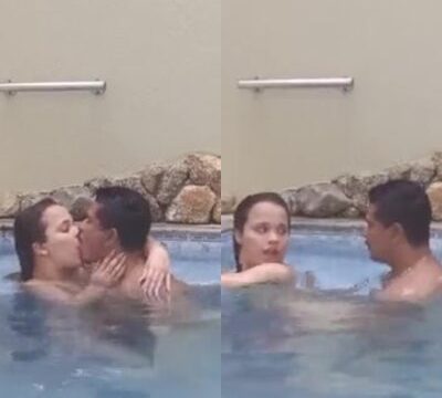 Mujer dando su coño a su novio en la piscina