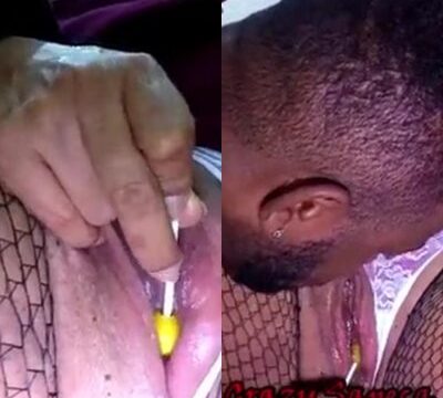 Mujer masturbándose con una piruleta en el coño