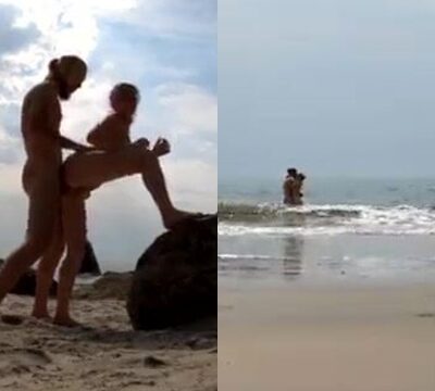 Mujer traviesa teniendo sexo en una playa desierta con su novio
