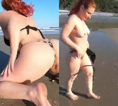 Zorra desnudándose en la playa mostrando su coño